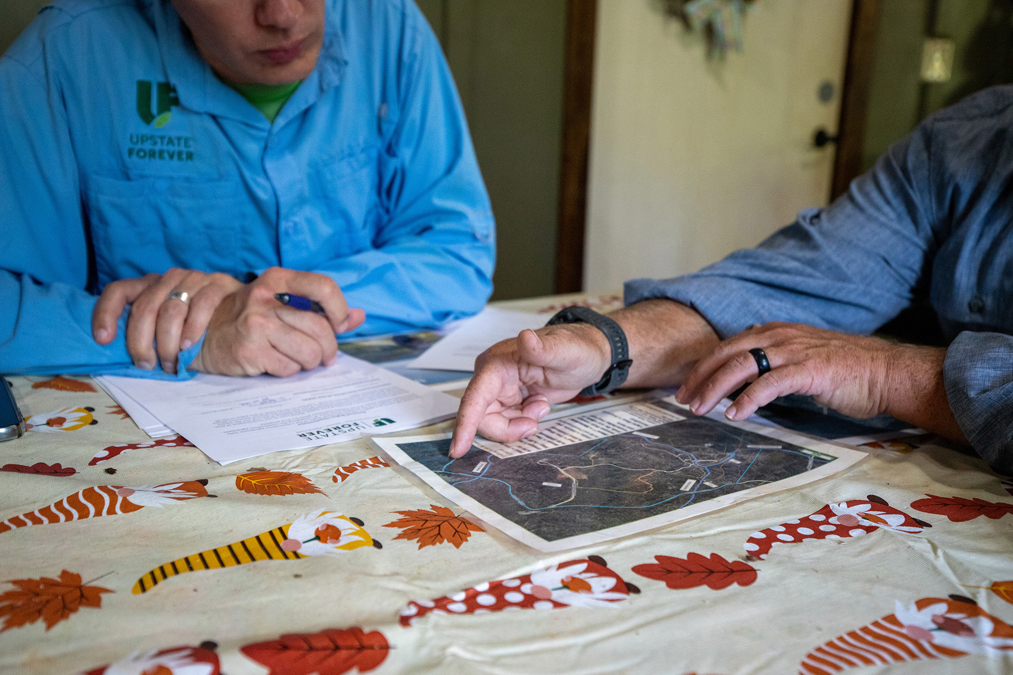 Scott Park reviews a map created in GIS as part of conversations surrounding a conservation easement.